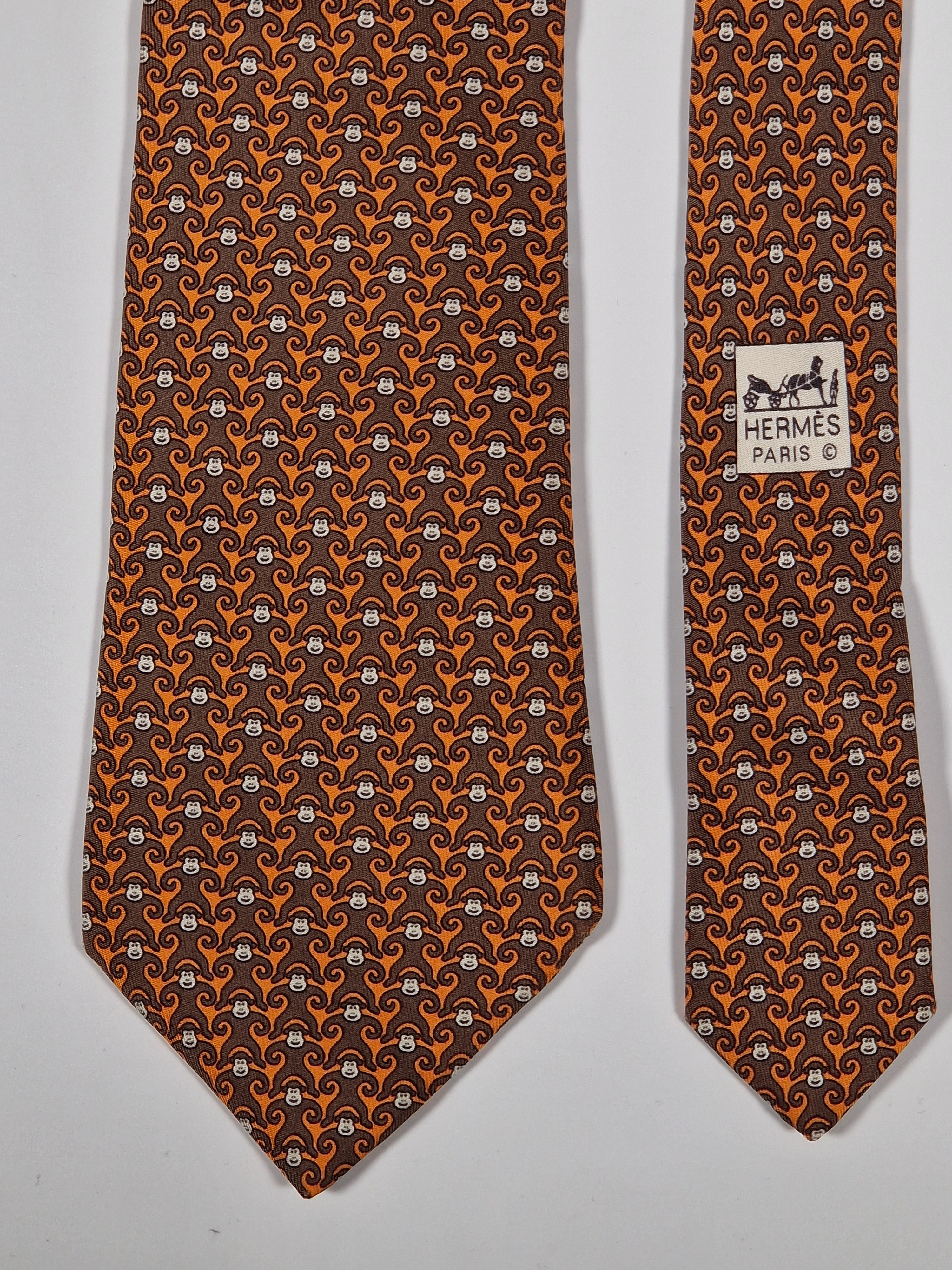Hermès silk tie orange and brown monkey pattern 5384 oa