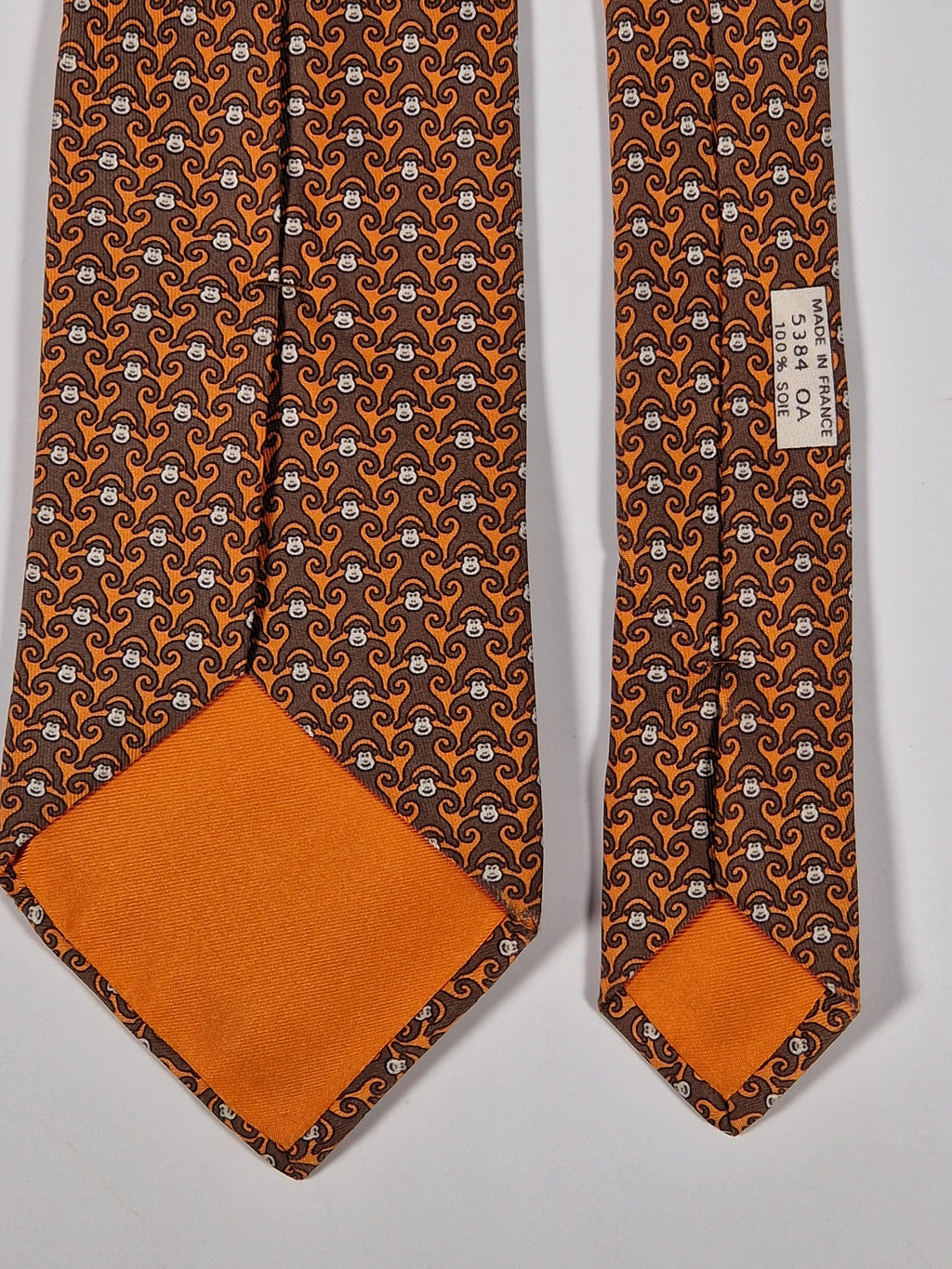 Hermès silk tie orange and brown monkey pattern 5384 oa