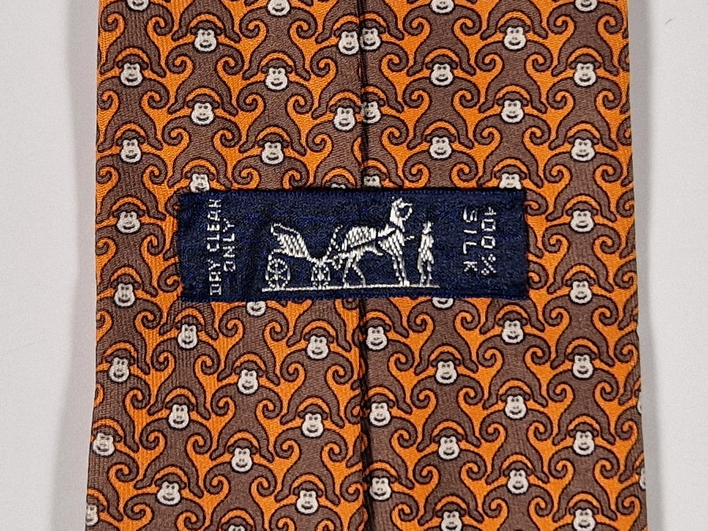 Hermès silk tie orange and brown monkey pattern 5384 oa