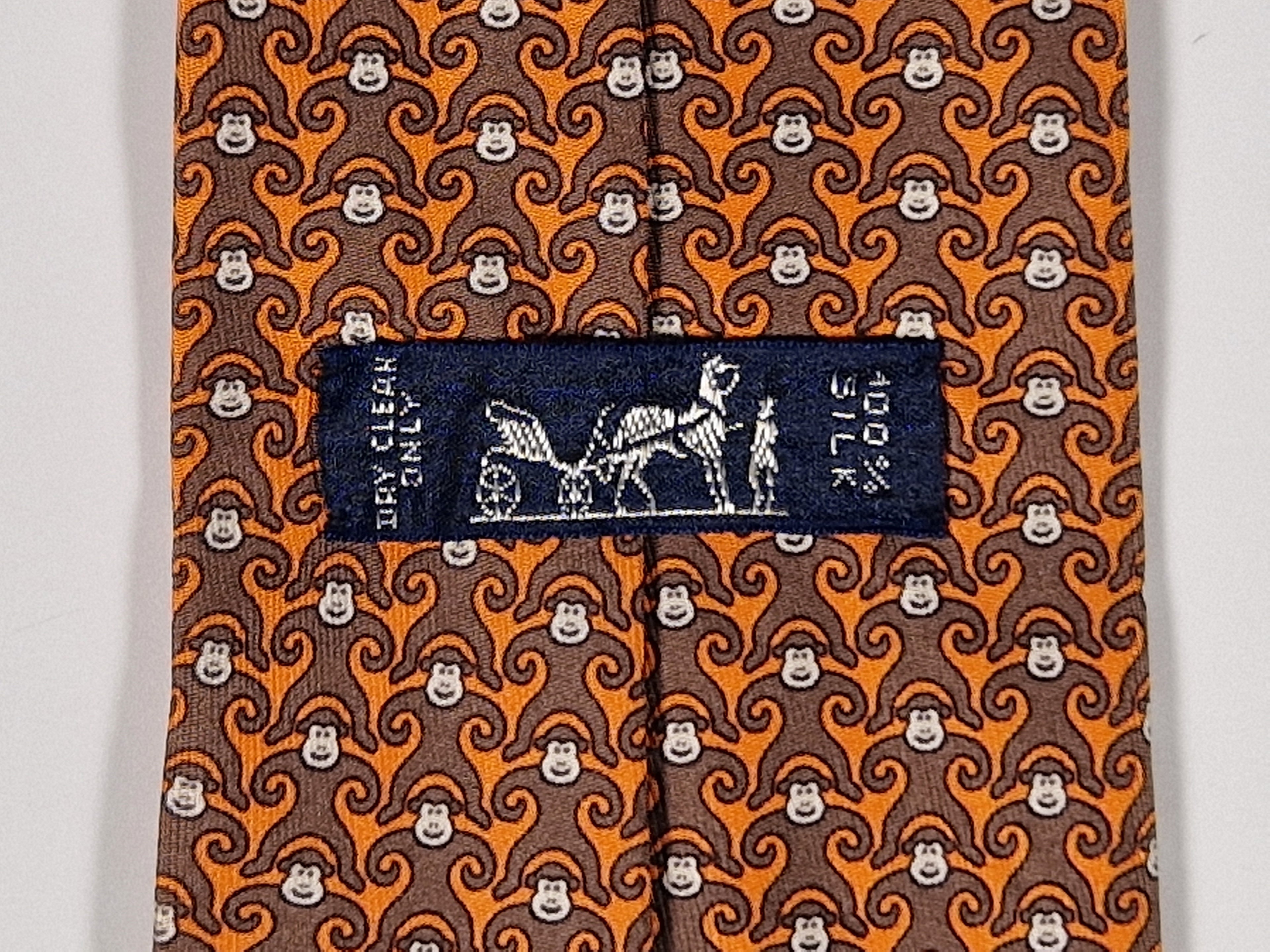 Hermès silk tie orange and brown monkey pattern 5384 oa