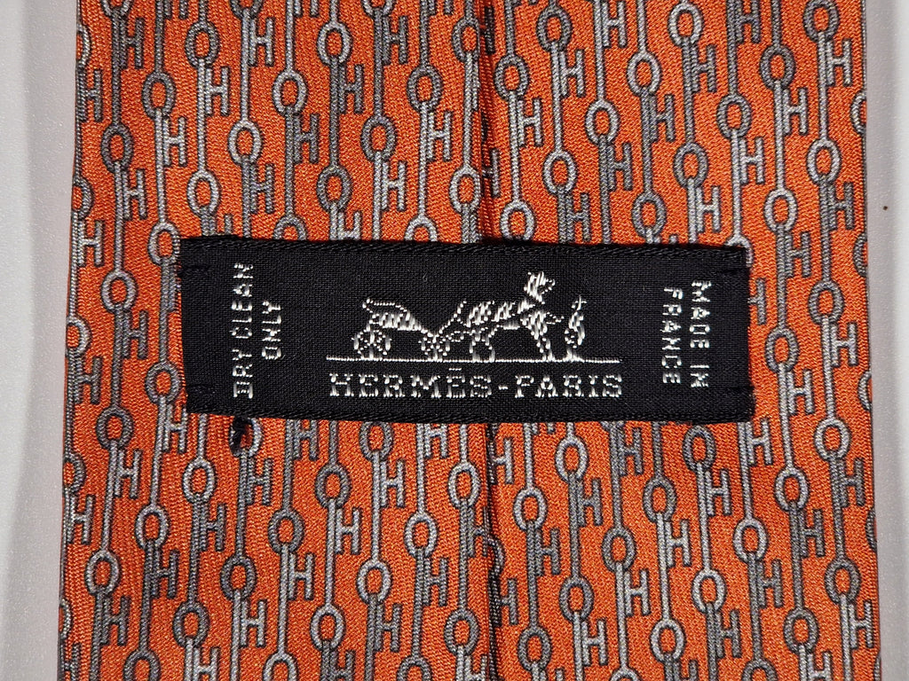 Hermès silk tie orange key pattern "UBS Bank Switzerland" 605703 FA