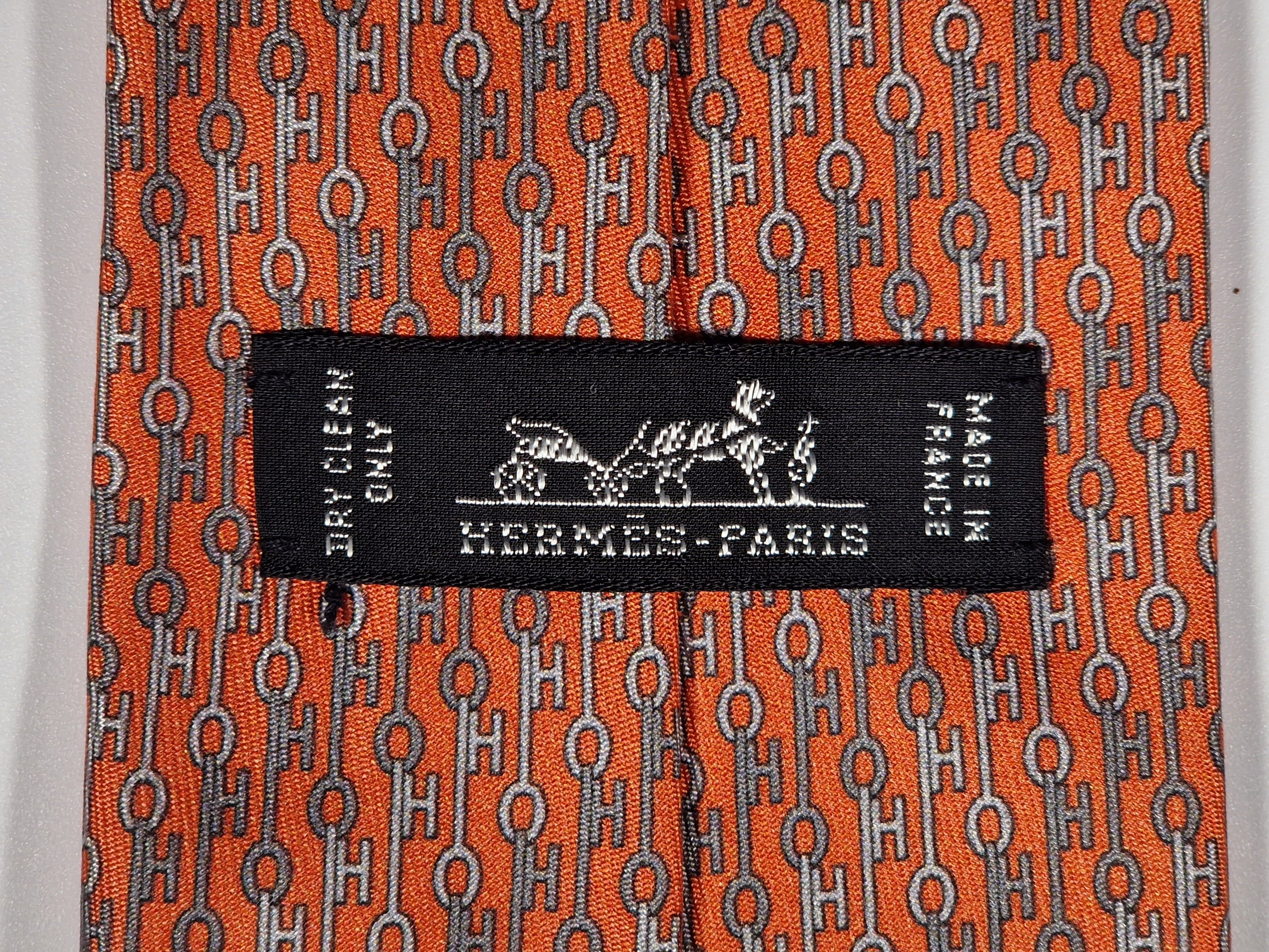 Hermès silk tie orange key pattern "UBS Bank Switzerland" 605703 FA