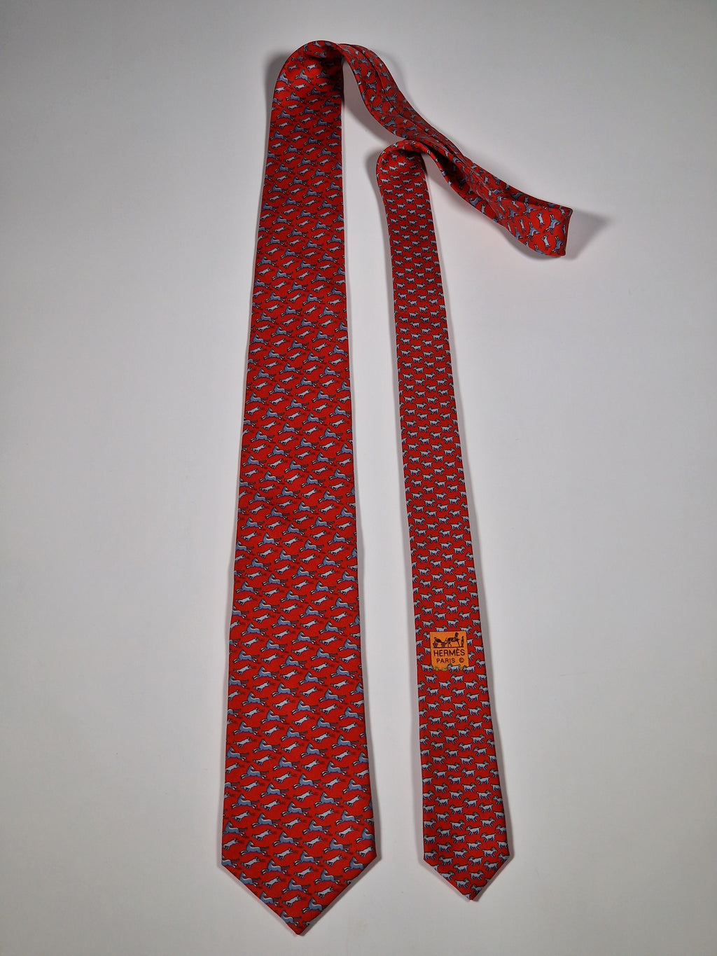 Hermès silk tie red whimsical horse and goat pattern 625800 HA