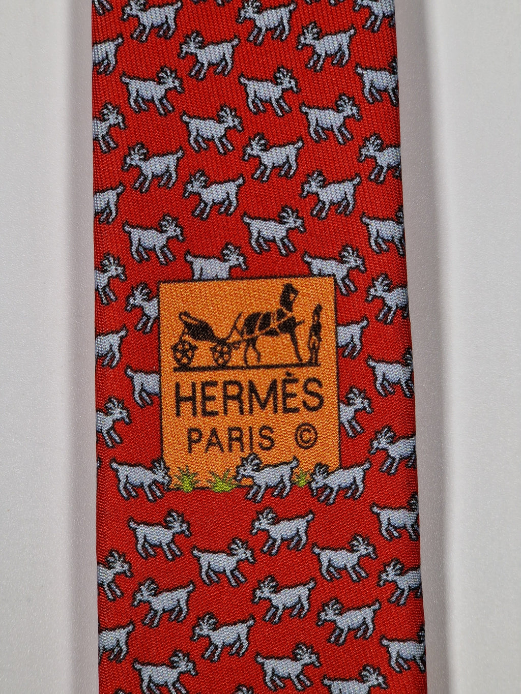 Hermès silk tie red whimsical horse and goat pattern 625800 HA