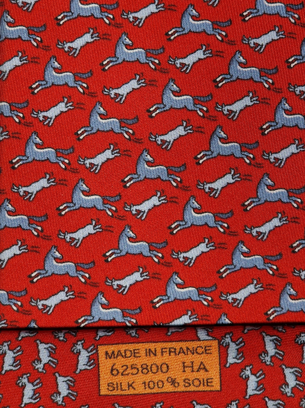 Hermès silk tie red whimsical horse and goat pattern 625800 HA