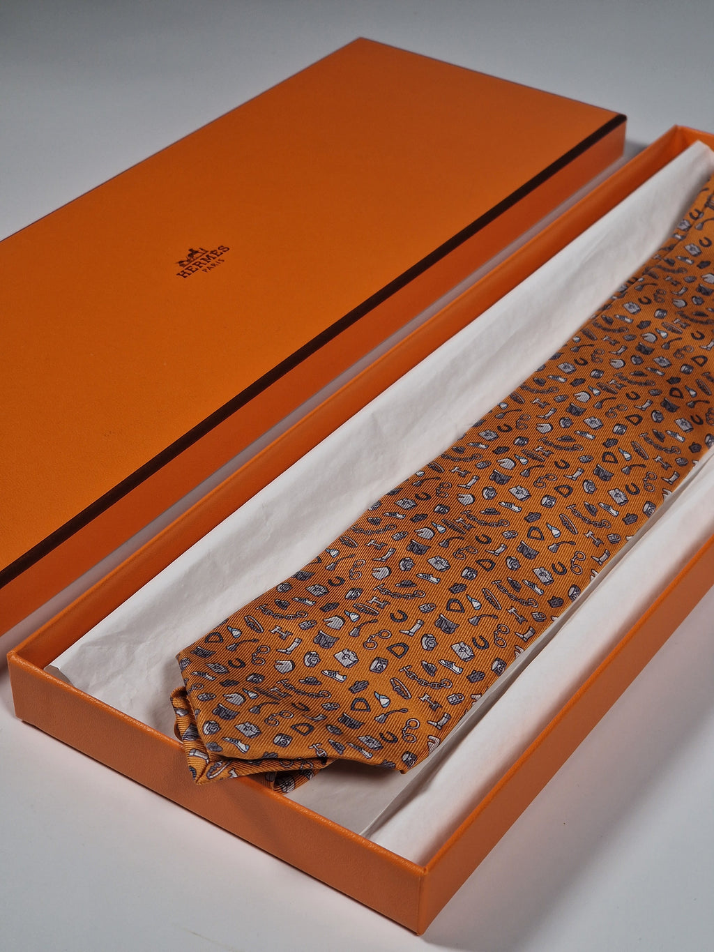 Hermès silk tie orange quincaillerie du faub pattern 6354 HA with box