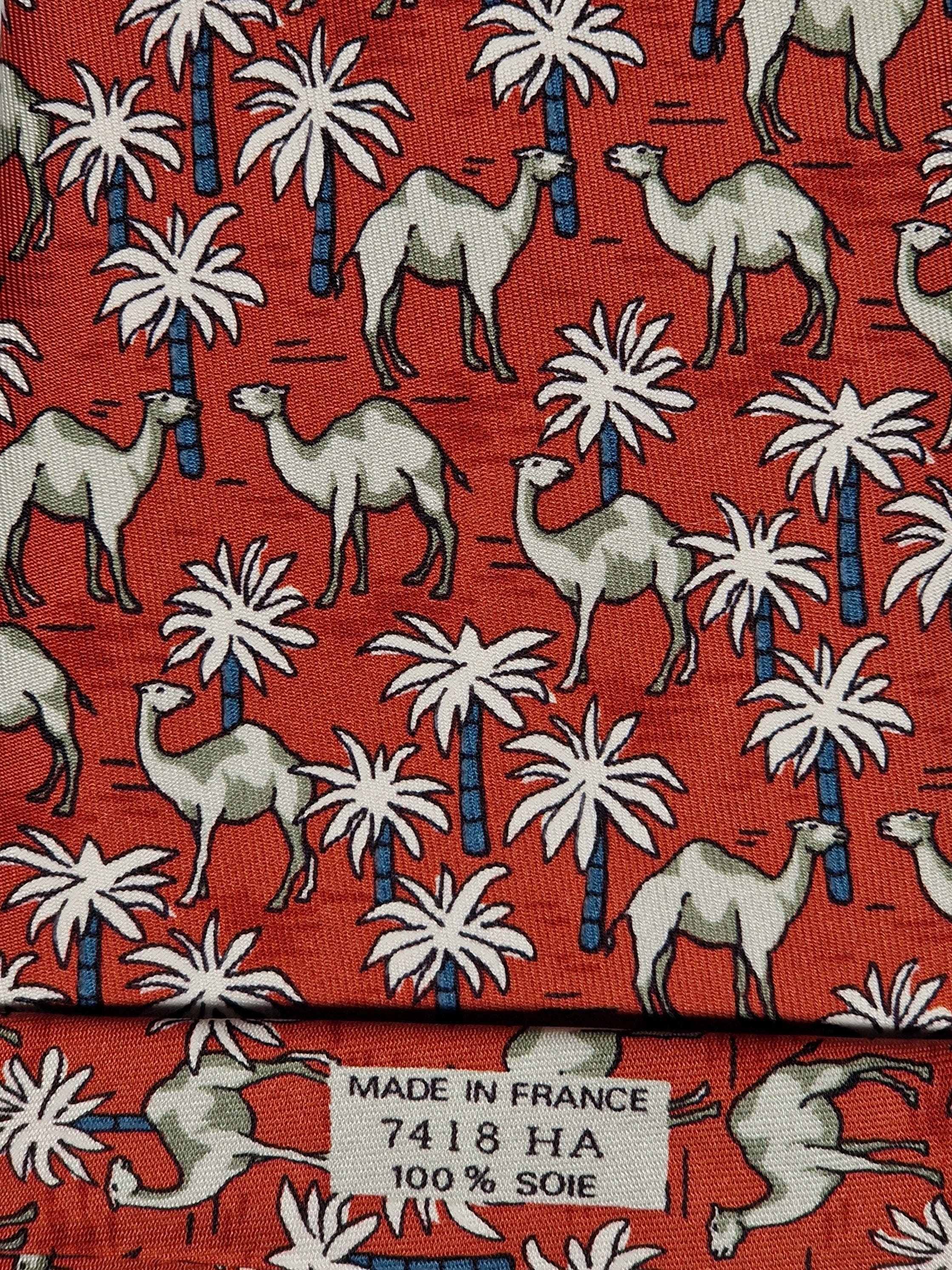 Hermès silk tie red Dromedaries and palm trees whimsical pattern 7418 HA