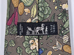 007460 Hermès tie green whimsical vegitables 7460 HA OBS color different in the object.