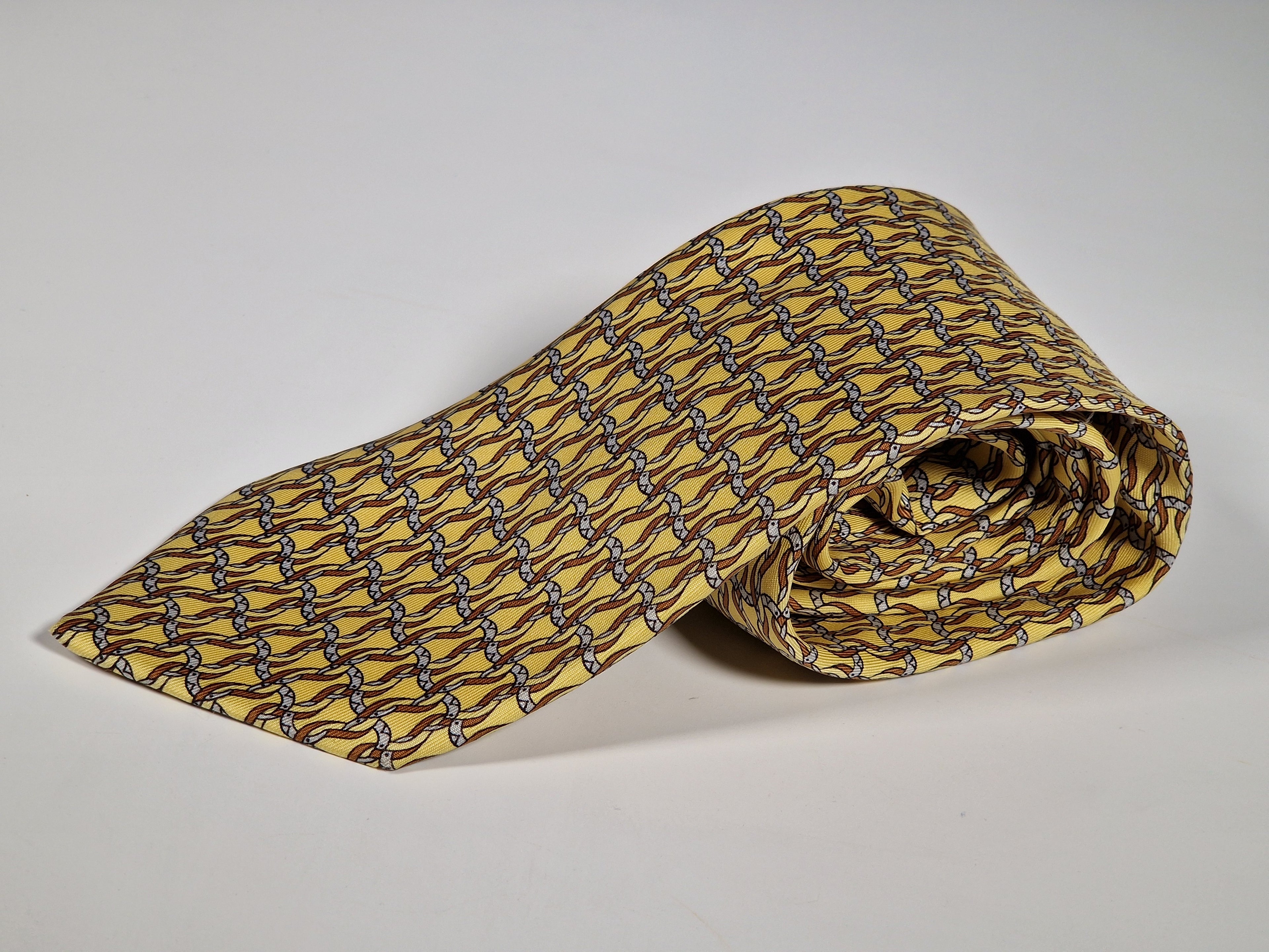 Hermès silk tie yellow horseshoe equestrian pattern 7523 IA