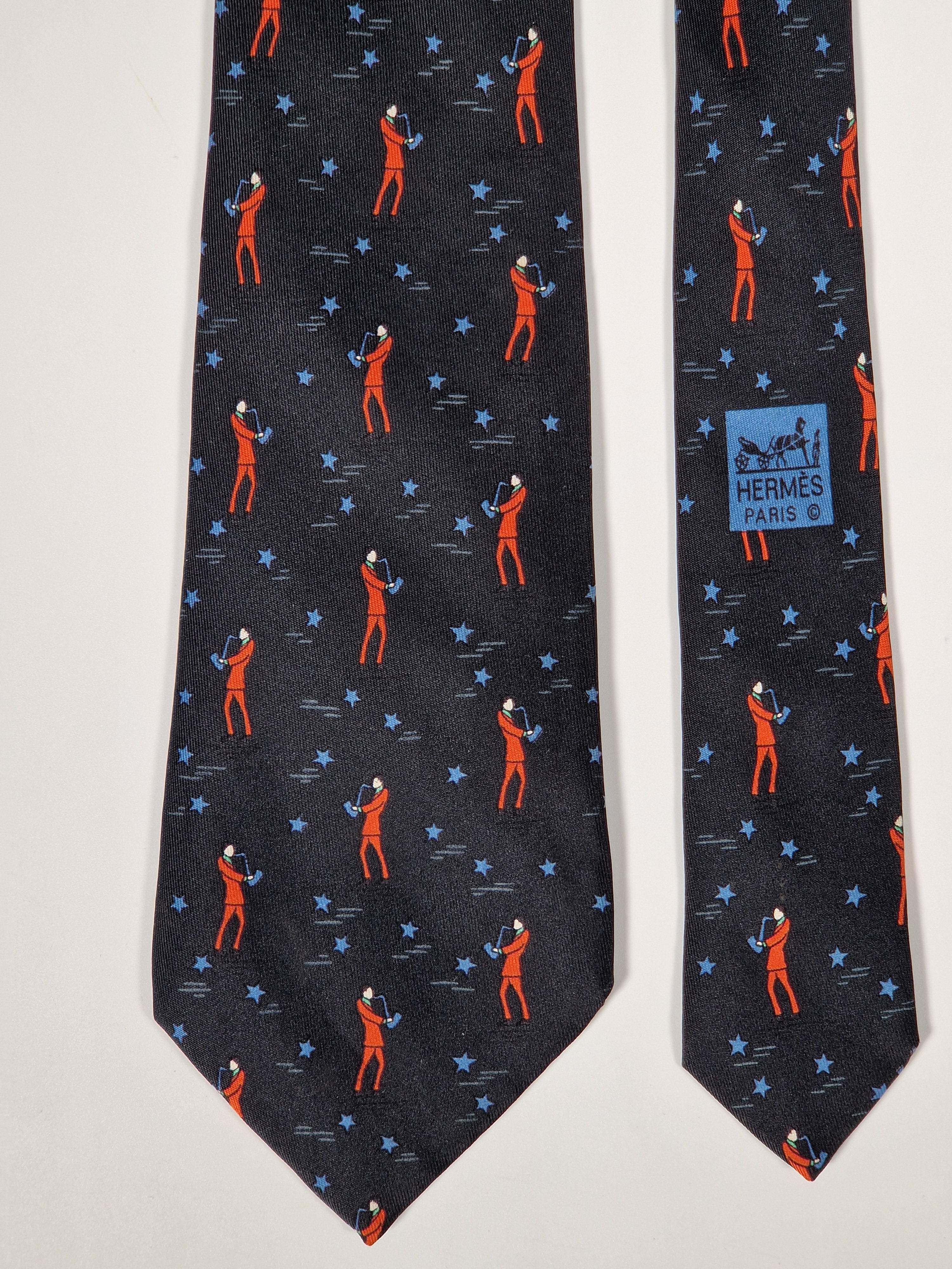Hermès silk tie black saxophone player whimsical pattern 7551 SA