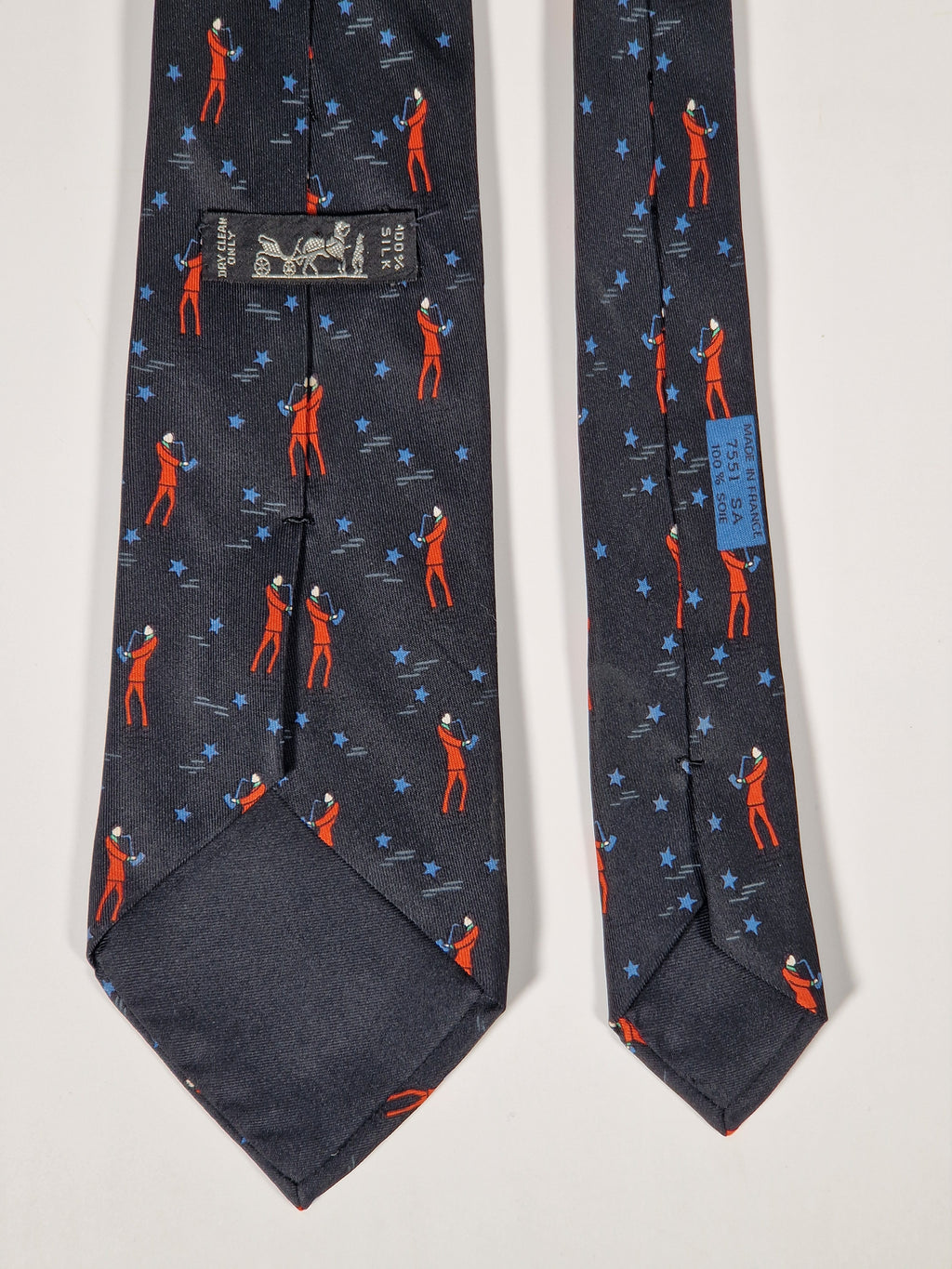 Hermès silk tie black saxophone player whimsical pattern 7551 SA
