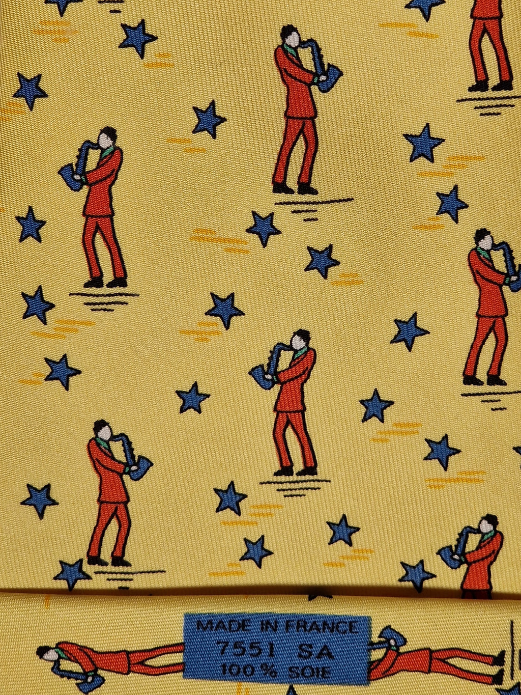 007551 Hermès tie yellow saxophone player 7551 SA