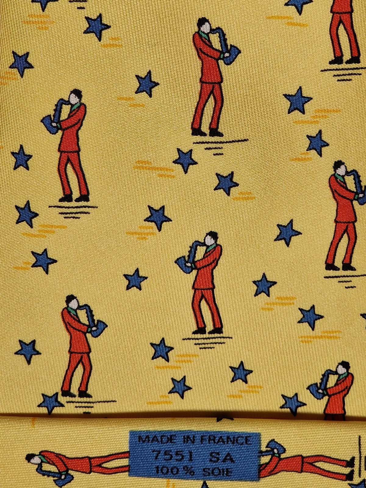 007551 Hermès tie yellow saxophone player 7551 SA