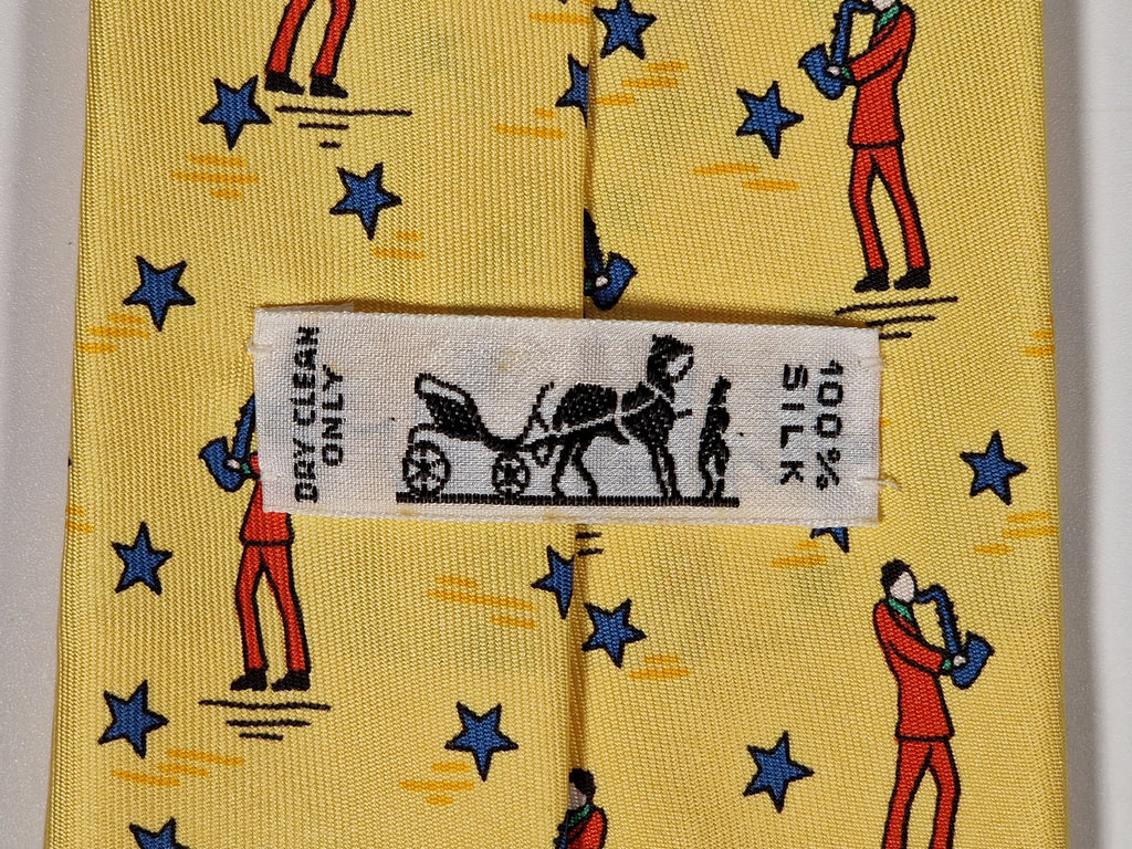 007551 Hermès tie yellow saxophone player 7551 SA