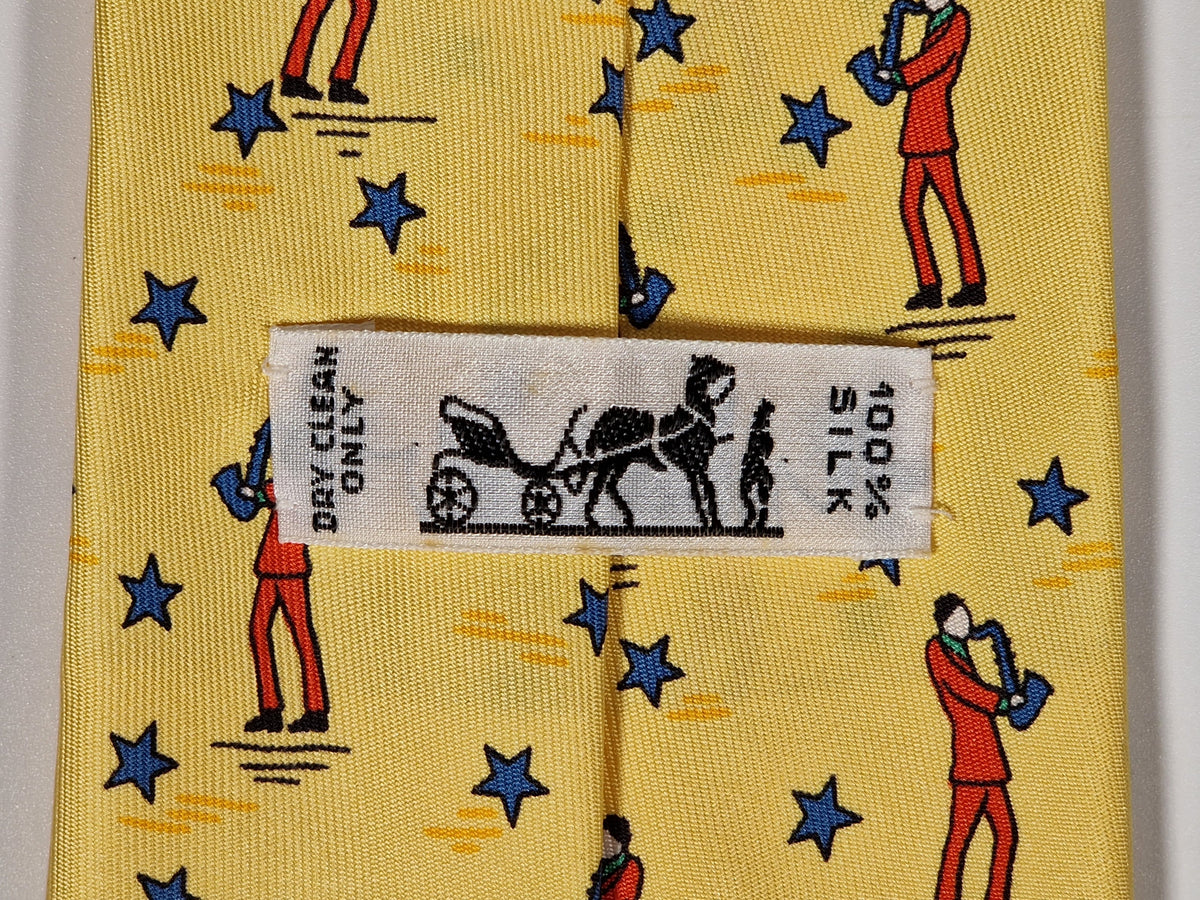 007551 Hermès tie yellow saxophone player 7551 SA