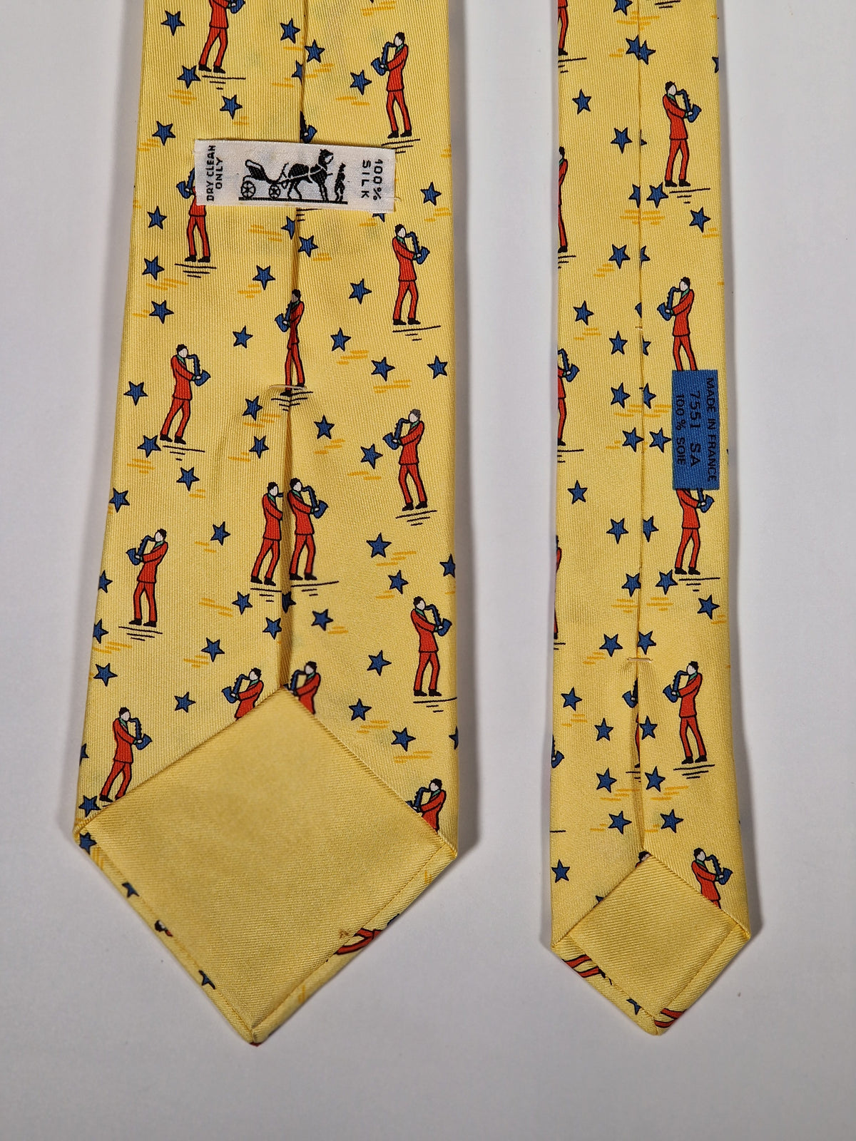 007551 Hermès tie yellow saxophone player 7551 SA