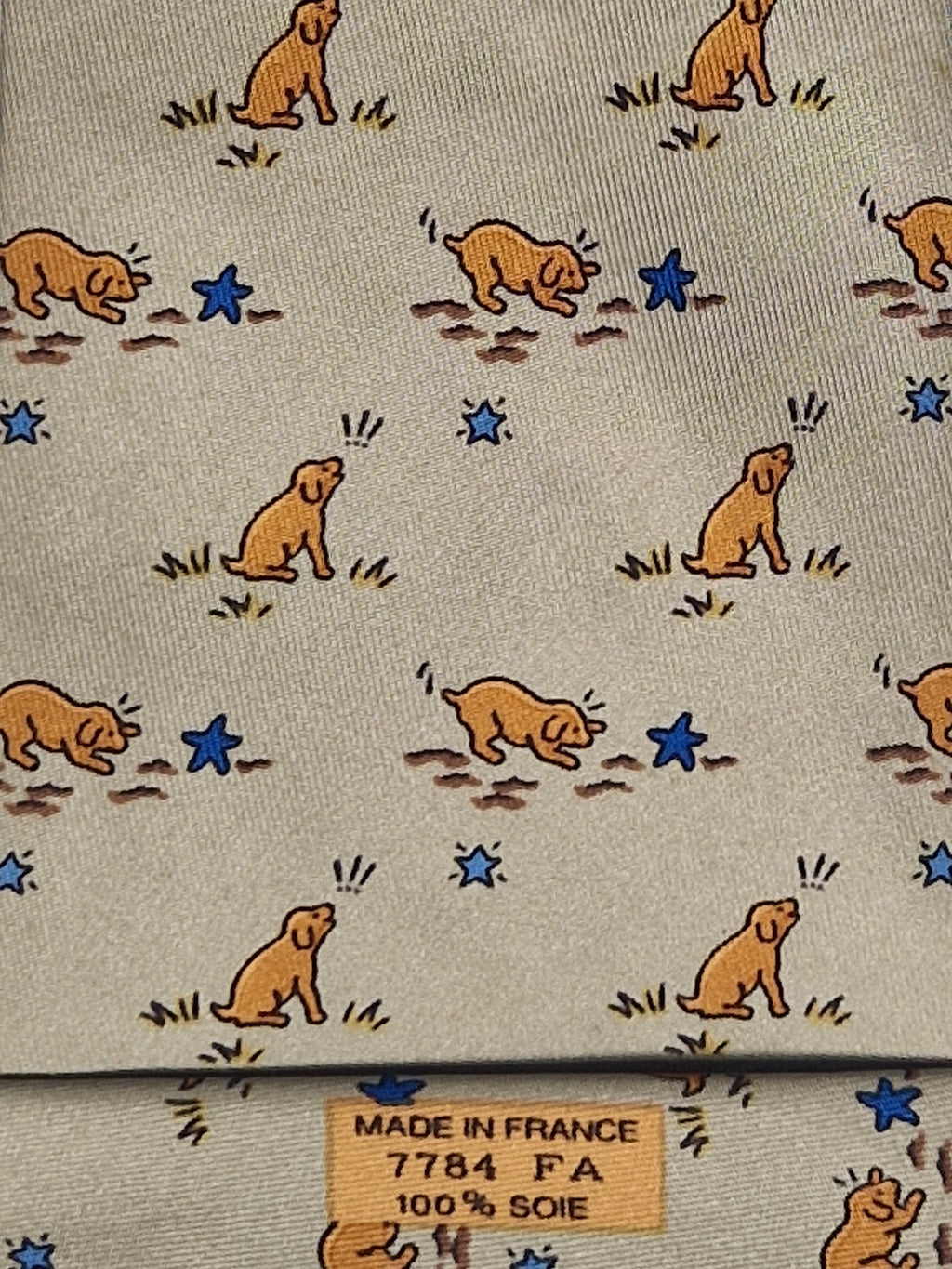 007784 Hermès tie beige puppy and star pattern 7784 FA