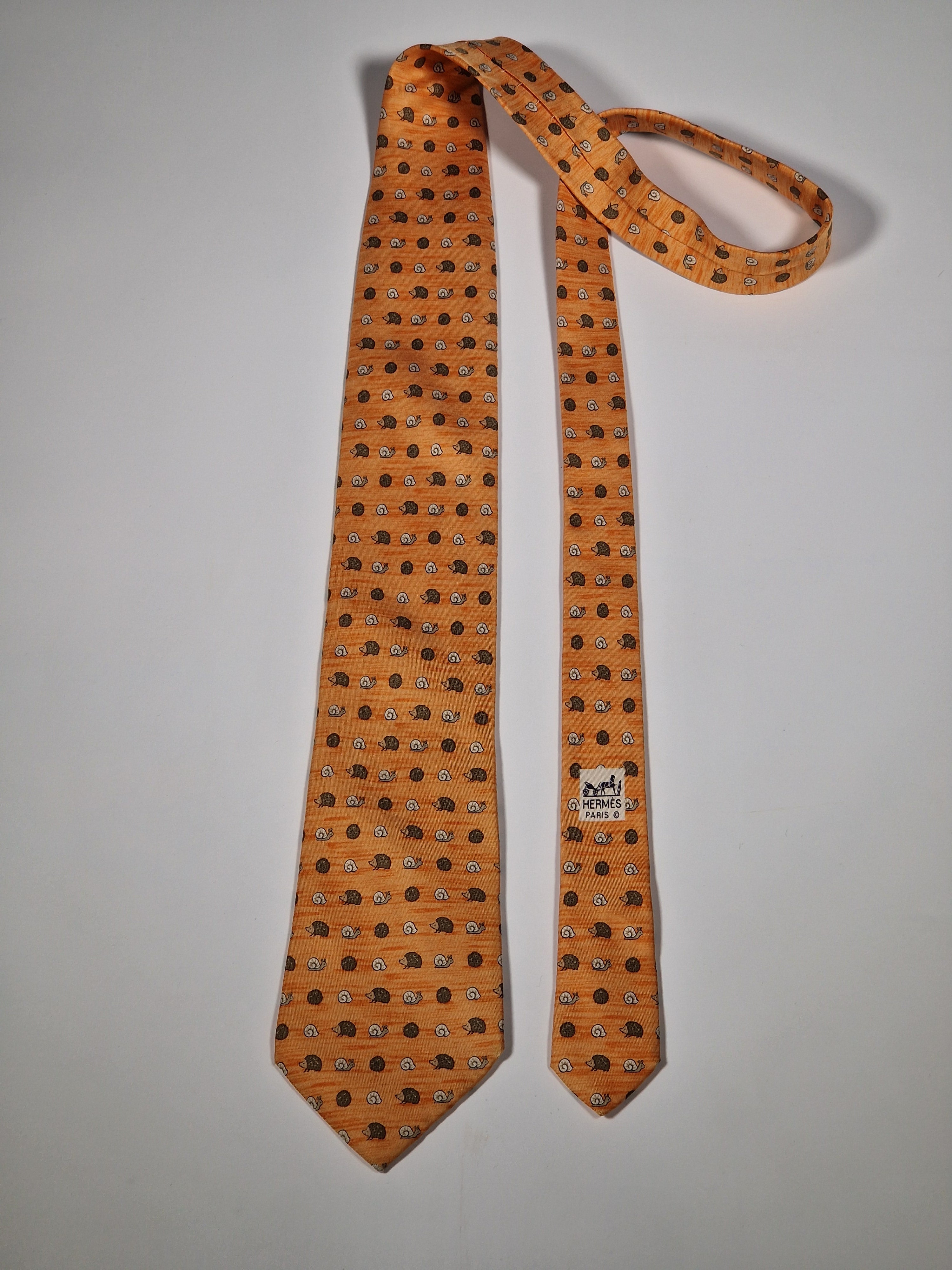 Hermès silk tie orange hedgehog and snail whimsical pattern 7850 UA