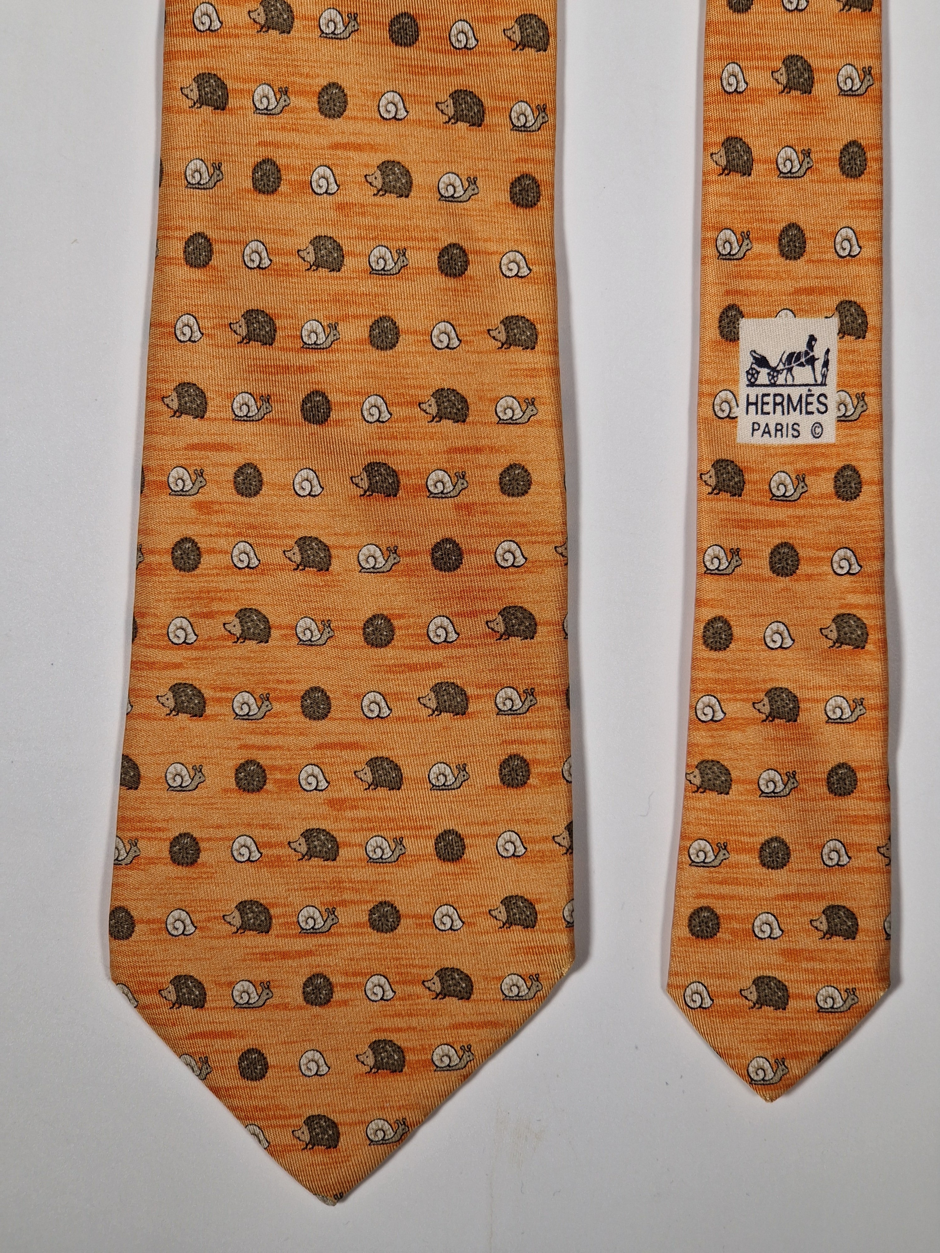 Hermès silk tie orange hedgehog and snail whimsical pattern 7850 UA