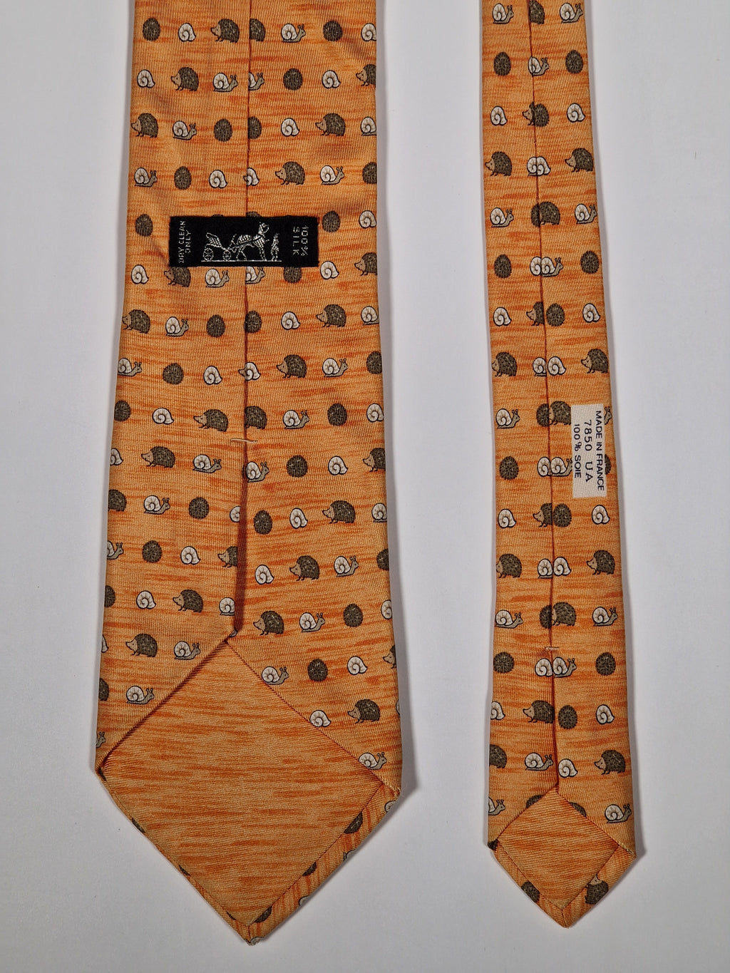 Hermès silk tie orange hedgehog and snail whimsical pattern 7850 UA