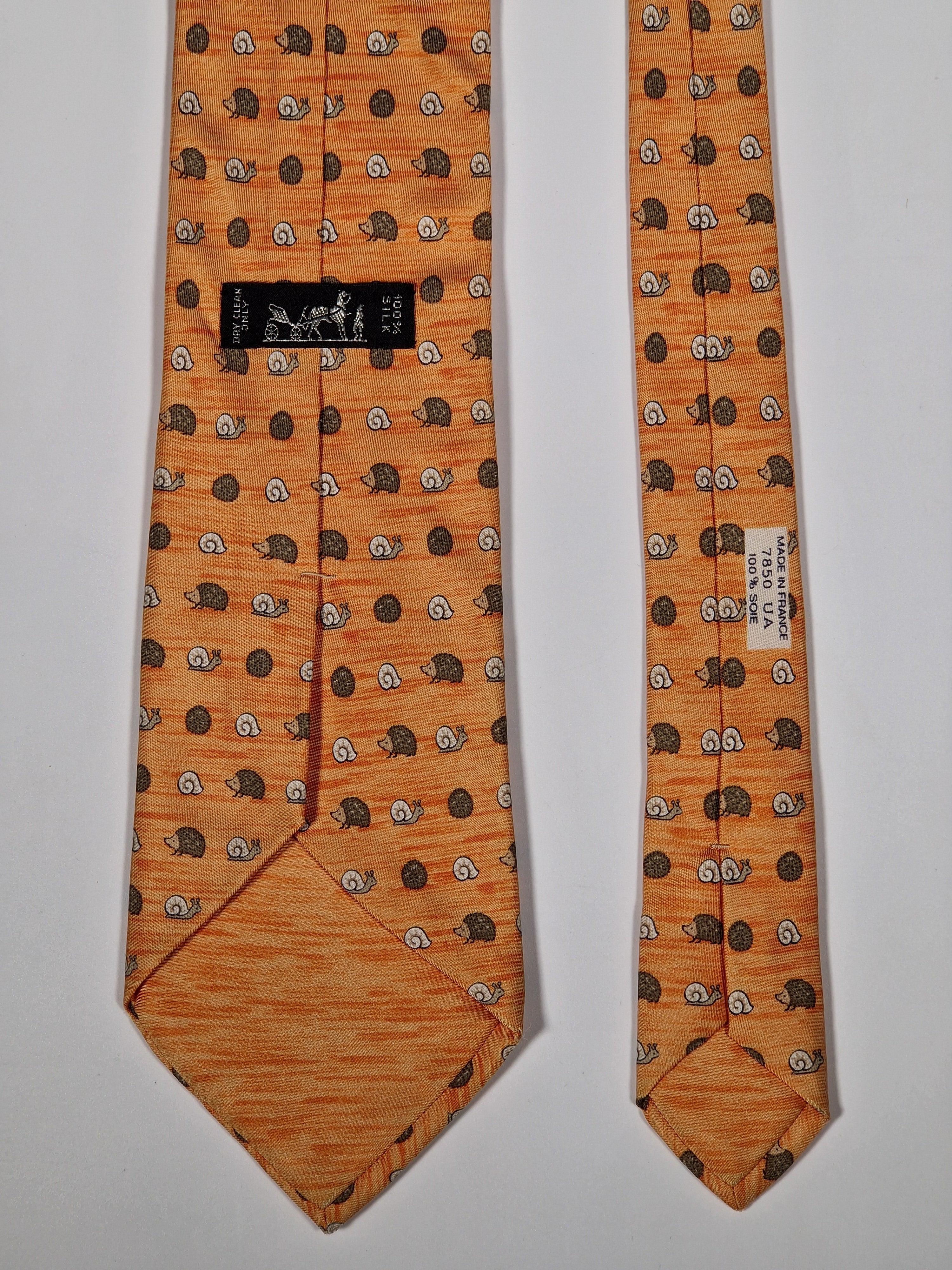 Hermès silk tie orange hedgehog and snail whimsical pattern 7850 UA