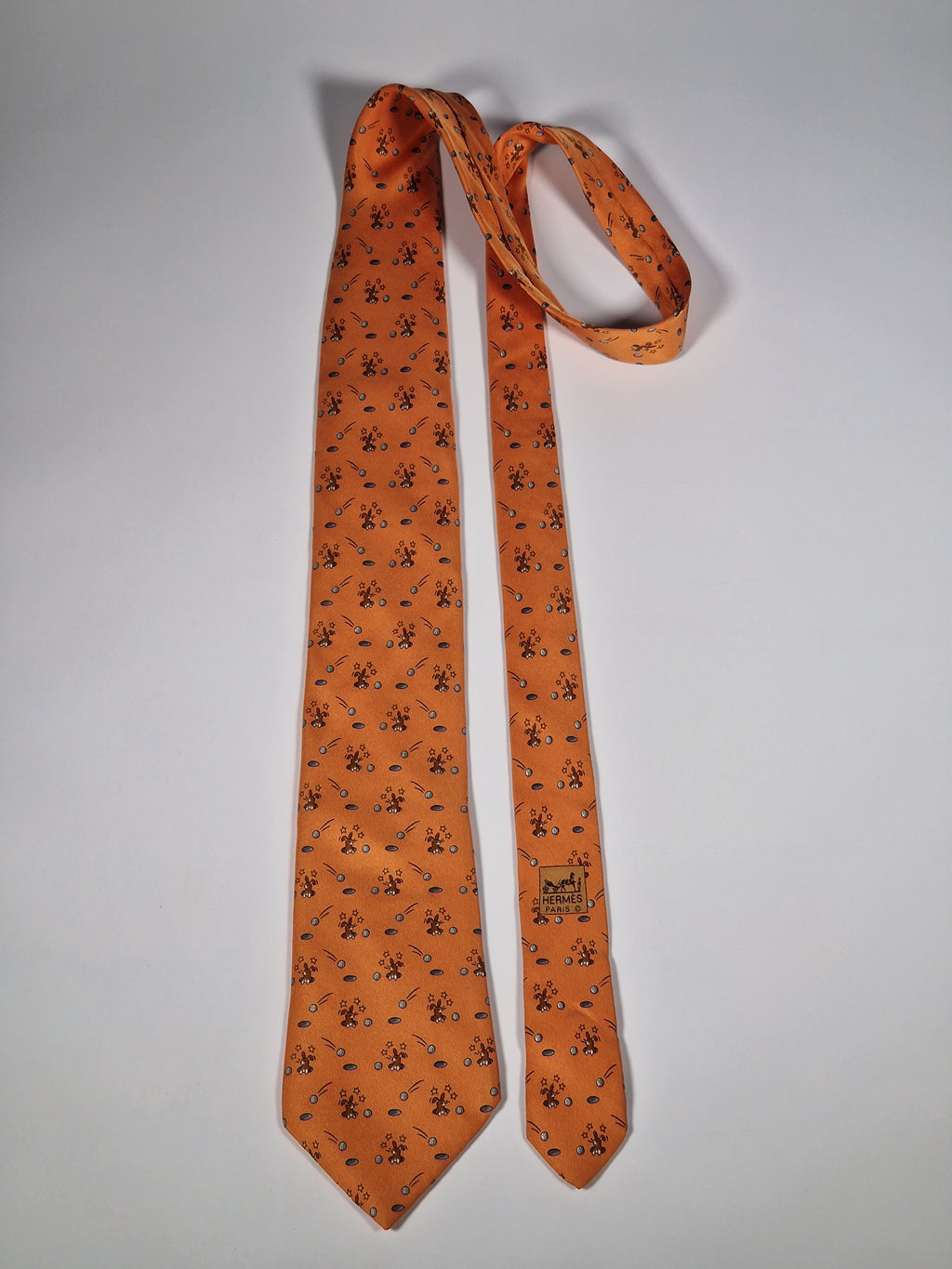 Hermès silk tie orange whimsical rabbit and golf pattern 7956 EA
