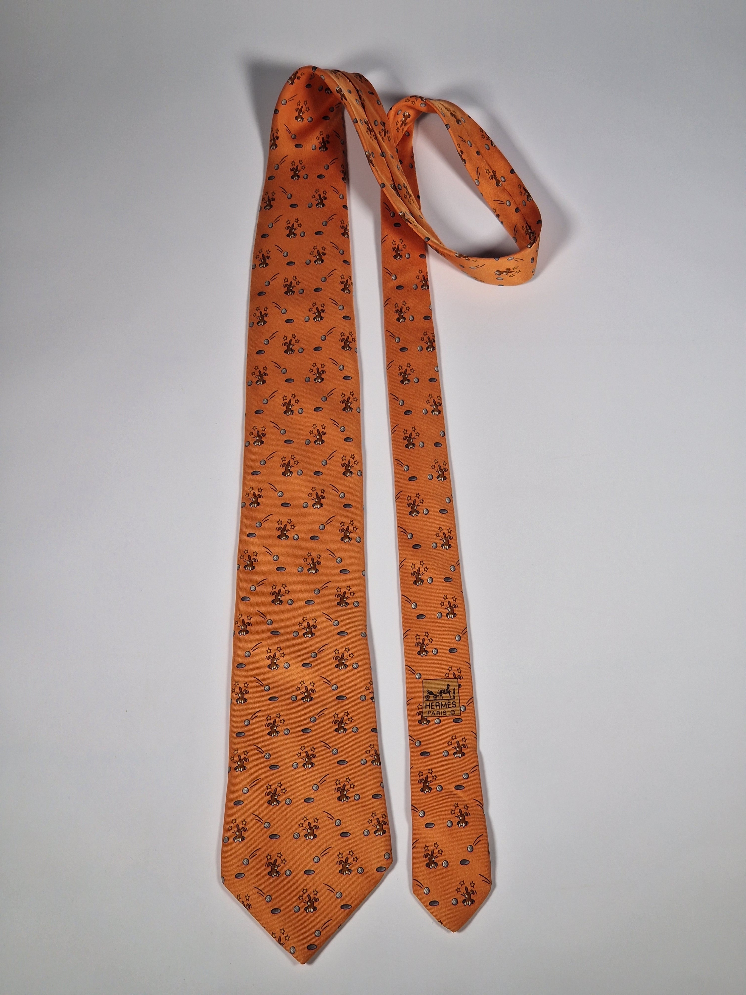 Hermès silk tie orange whimsical rabbit and golf pattern 7956 EA