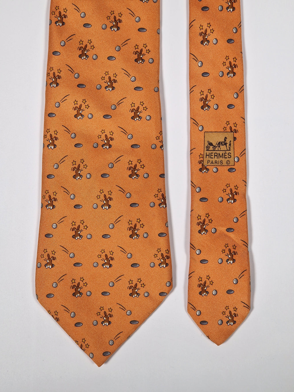 Hermès silk tie orange whimsical rabbit and golf pattern 7956 EA