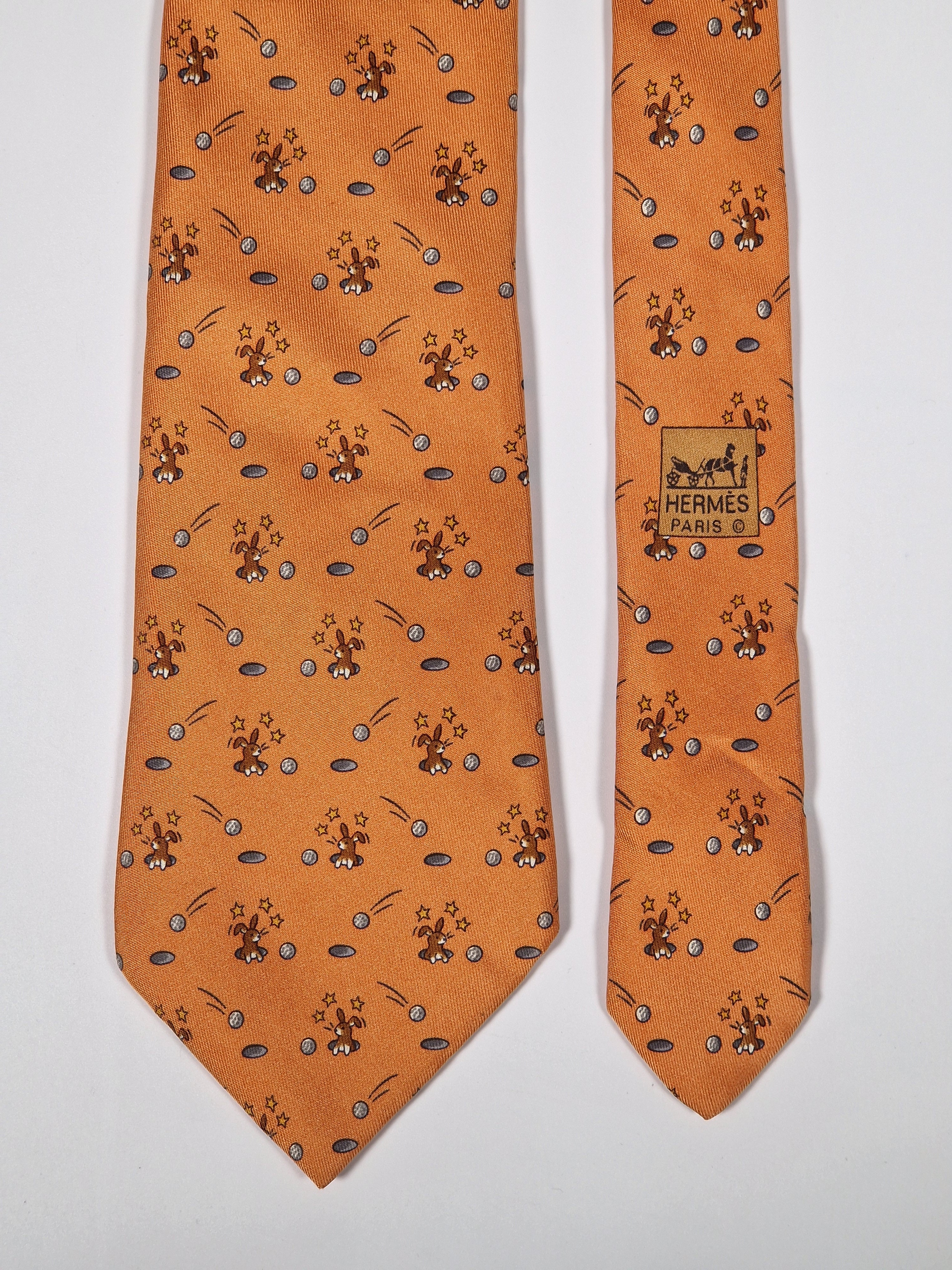 Hermès silk tie orange whimsical rabbit and golf pattern 7956 EA