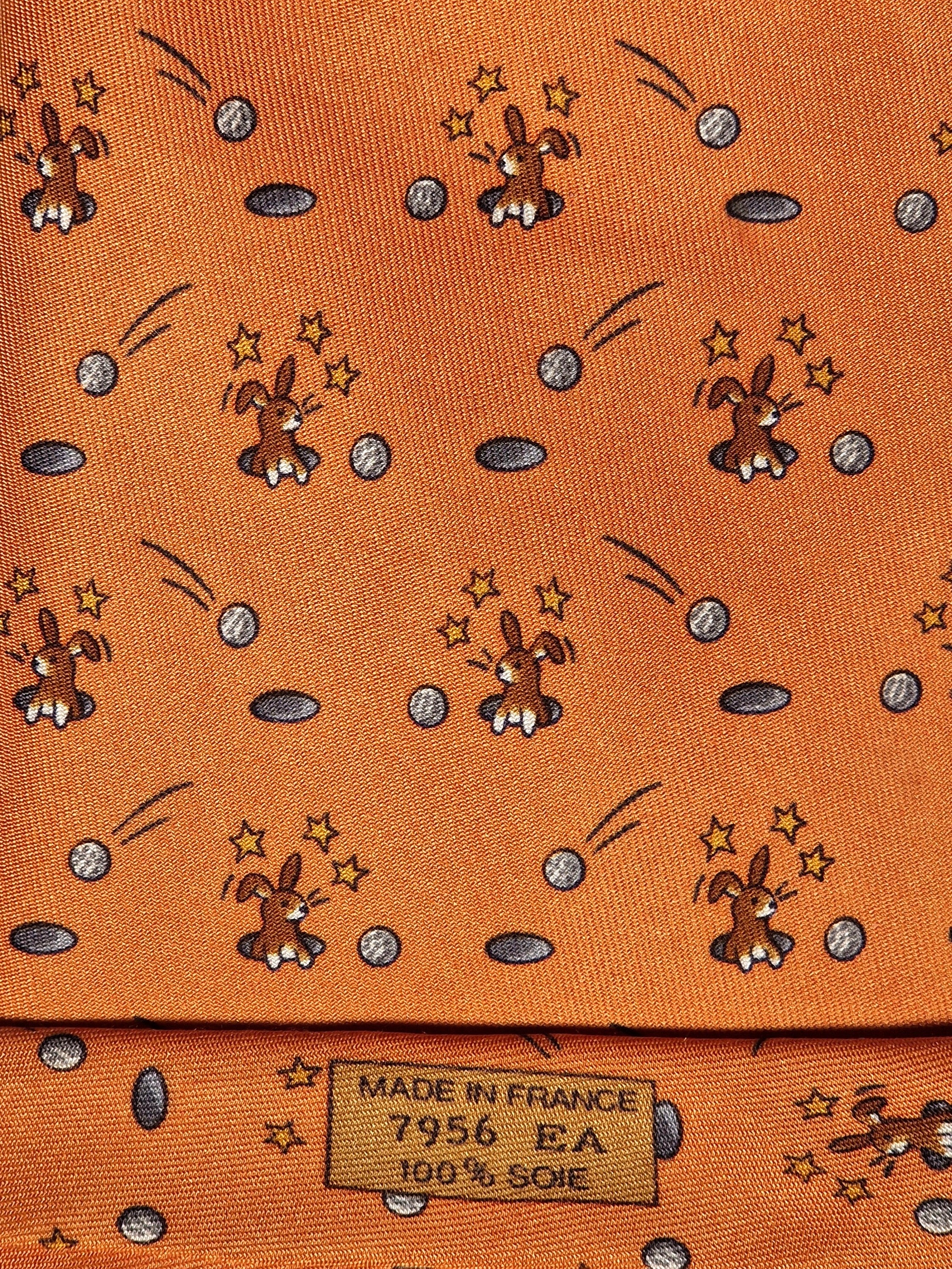 Hermès silk tie orange whimsical rabbit and golf pattern 7956 EA