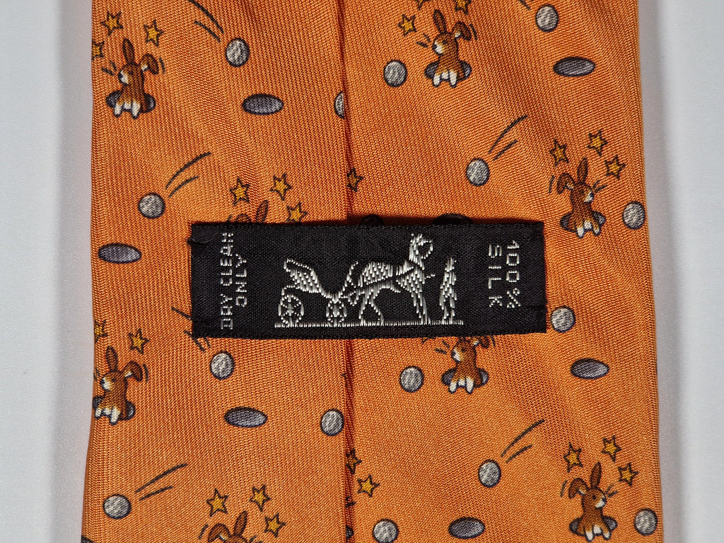 Hermès silk tie orange whimsical rabbit and golf pattern 7956 EA