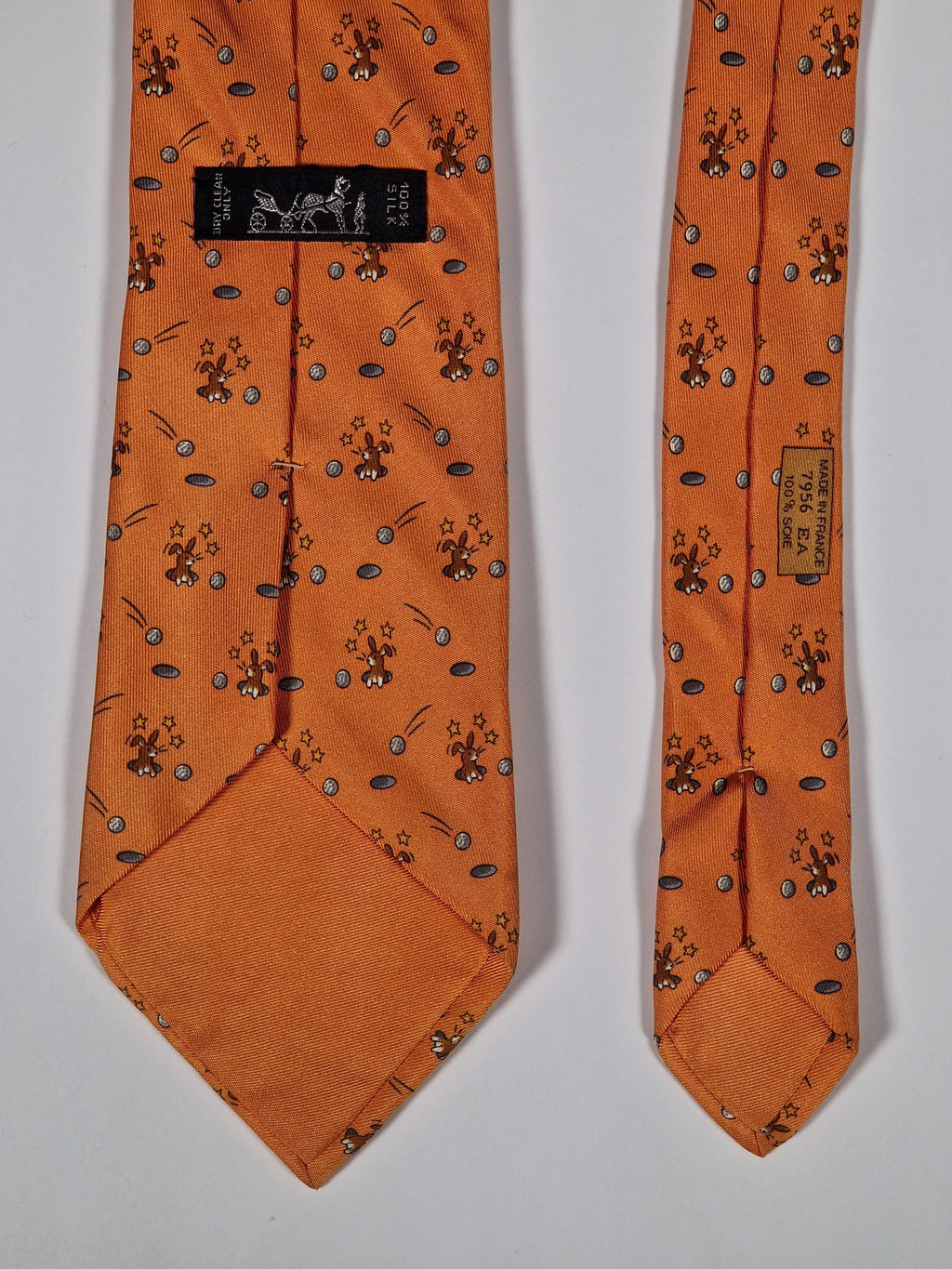 Hermès silk tie orange whimsical rabbit and golf pattern 7956 EA