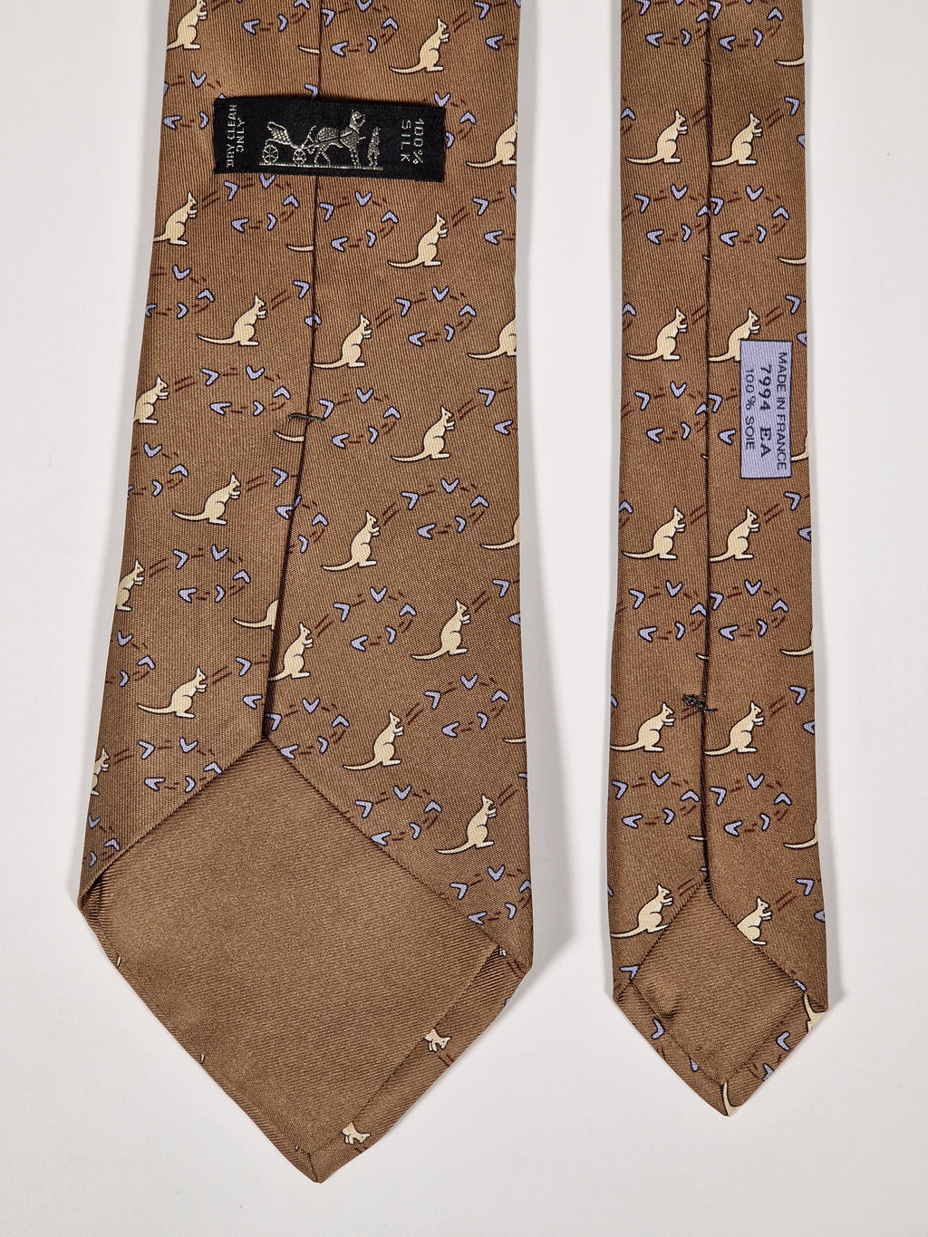 007994 Hermès tie brown whimsical kangaroo and boomerang pattern 7994 EA