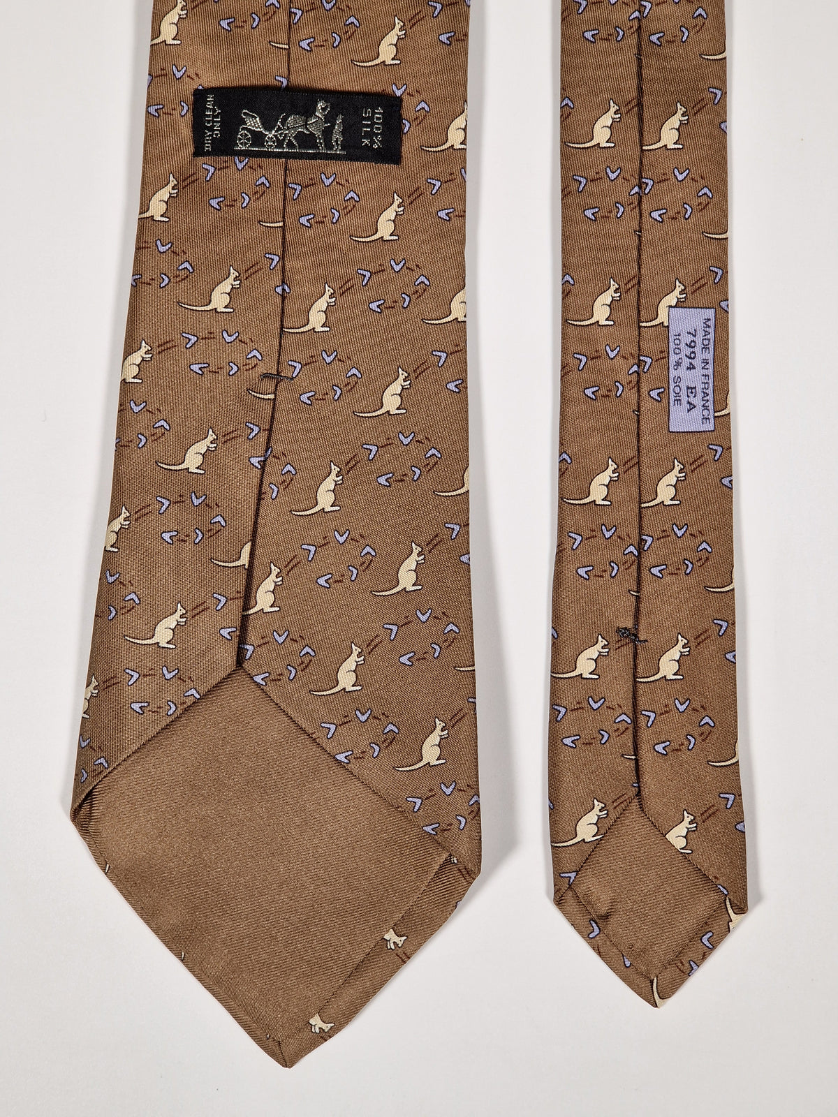 007994 Hermès tie brown whimsical kangaroo and boomerang pattern 7994 EA