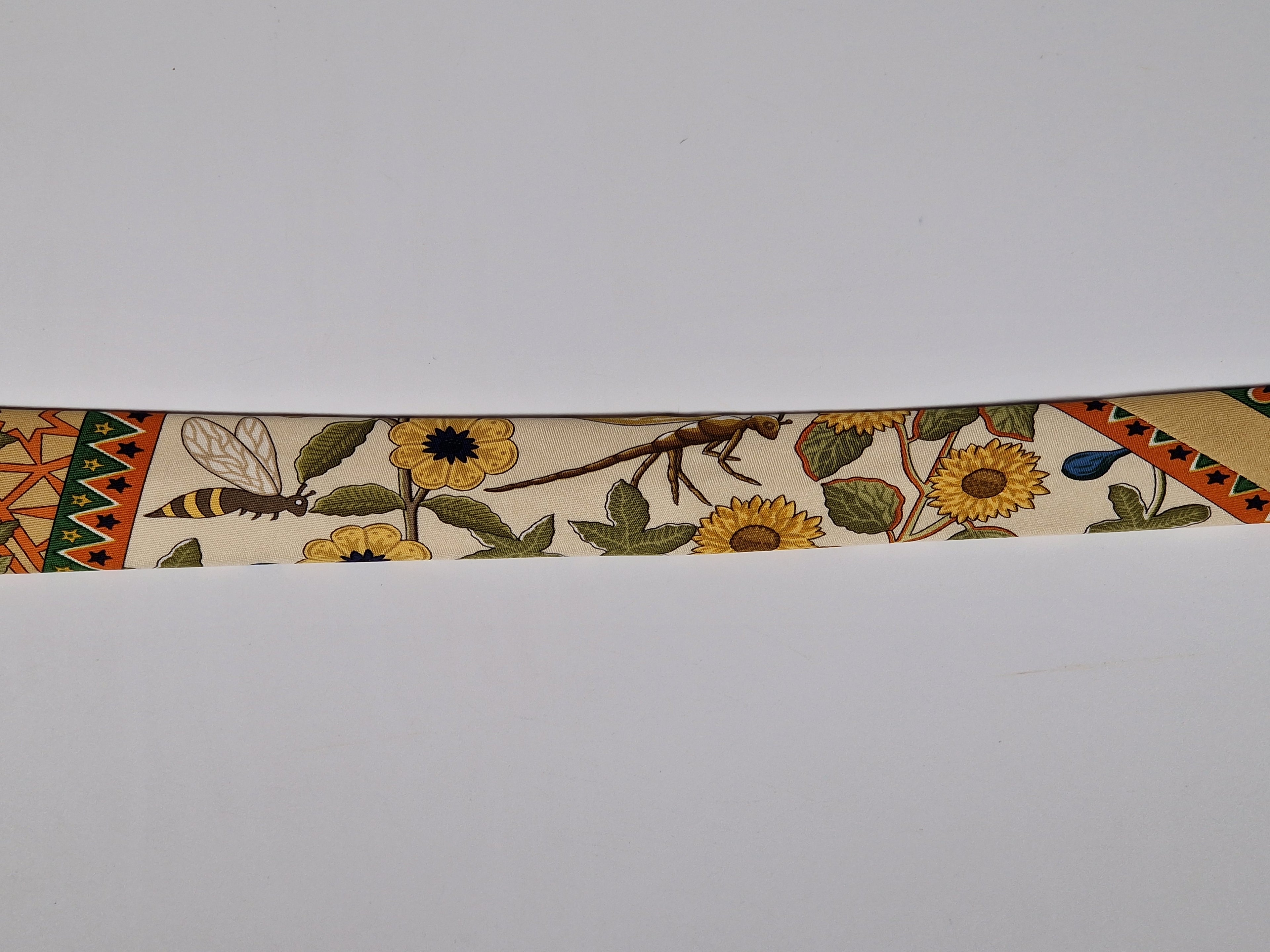 Hermès silk tie flowers trees and rainbow Hermès No Cod tie